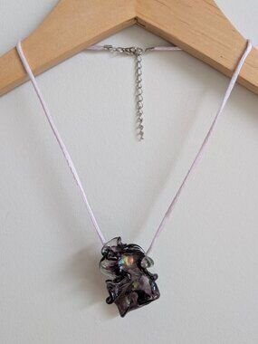 Abstract large blown glass look pendant on light purple silky cord necklace